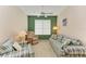 Cozy living room with plaid sofas and a ceiling fan at 6710 Pebble Beach Way, Lakewood Ranch, FL 34202