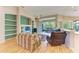 Open concept living room with hardwood floors and built-in shelving at 6710 Pebble Beach Way, Lakewood Ranch, FL 34202