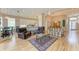 Spacious living room with hardwood floors and access to the patio at 6710 Pebble Beach Way, Lakewood Ranch, FL 34202