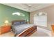Main bedroom with king-size bed, ceiling fan, and ample natural light at 6710 Pebble Beach Way, Lakewood Ranch, FL 34202