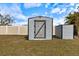 Grey storage shed in the backyard at 6756 Electra Ave, North Port, FL 34287