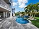 Stunning freeform pool with large patio and lush landscaping at 690 Russell St, Longboat Key, FL 34228