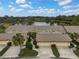 Aerial view of the property showing a community of villas and lake access at 7146 Lakeside Dr, Sarasota, FL 34243