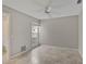 Spacious bedroom with tile floors and a large window at 7146 Lakeside Dr, Sarasota, FL 34243