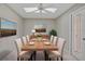 Bright dining room with wood table and six chairs, ready for Gathering meals at 7146 Lakeside Dr, Sarasota, FL 34243