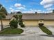 Front exterior of the property with a driveway and landscaping at 7146 Lakeside Dr, Sarasota, FL 34243