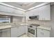 Kitchen with granite countertops and stainless steel appliances at 7146 Lakeside Dr, Sarasota, FL 34243