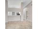 Open floor plan with kitchen island and view into living room at 7146 Lakeside Dr, Sarasota, FL 34243