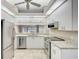 Bright kitchen with stainless steel appliances and granite countertops at 7146 Lakeside Dr, Sarasota, FL 34243