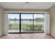 Spacious lanai with sliding doors and lake view at 7146 Lakeside Dr, Sarasota, FL 34243