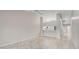 Living room with tile floors and kitchen bar at 7146 Lakeside Dr, Sarasota, FL 34243
