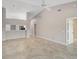 Living room with tile floors and views to kitchen and hallway at 7146 Lakeside Dr, Sarasota, FL 34243