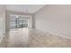 Living room with tile floors, sliding doors and lake view at 7146 Lakeside Dr, Sarasota, FL 34243