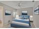 Main bedroom with a large bed, nightstands and a view at 7146 Lakeside Dr, Sarasota, FL 34243
