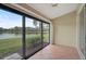 Serene screened patio showcasing a picturesque lake view at 7146 Lakeside Dr, Sarasota, FL 34243