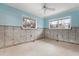 Needs renovation, featuring light blue walls and tile floors at 7147 Point Of Rocks Cir, Sarasota, FL 34242