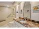 Bathroom boasts granite countertop and a walk-in shower at 7363 Silver Fern Blvd # 80, Sarasota, FL 34241