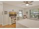Bedroom featuring a TV, comfortable seating, and large windows at 7363 Silver Fern Blvd # 80, Sarasota, FL 34241