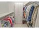 Large walk-in closet with double hanging rods and shelving at 7363 Silver Fern Blvd # 80, Sarasota, FL 34241