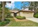 Well-maintained house with a landscaped yard and attached garage at 7363 Silver Fern Blvd # 80, Sarasota, FL 34241