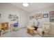 Home office with two comfy chairs and a work desk at 7363 Silver Fern Blvd # 80, Sarasota, FL 34241