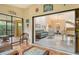 Bright sunroom with tiled floors and views of lush landscaping at 7363 Silver Fern Blvd # 80, Sarasota, FL 34241