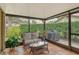 Spacious sunroom with wicker furniture and access to patio at 7363 Silver Fern Blvd # 80, Sarasota, FL 34241