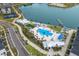 Aerial view of community pool, lake, and tennis courts at 7420 Newham Ln, Sarasota, FL 34240
