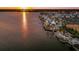Lakeside community at sunset with dock at 7420 Newham Ln, Sarasota, FL 34240