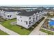 Aerial view of modern townhouses with lake access and community amenities at 7420 Newham Ln, Sarasota, FL 34240