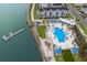 Aerial view of waterfront townhouses with pool and dock at 7420 Newham Ln, Sarasota, FL 34240