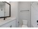 Clean bathroom with white tile and a modern vanity at 7420 Newham Ln, Sarasota, FL 34240
