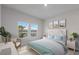 Bright bedroom with a comfortable bed and water views at 7420 Newham Ln, Sarasota, FL 34240