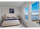 Bright bedroom with lake view and king-size bed at 7420 Newham Ln, Sarasota, FL 34240