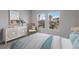 Bedroom with large windows and a view of the community at 7420 Newham Ln, Sarasota, FL 34240