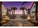Seating area with waterfront views and sunset at 7420 Newham Ln, Sarasota, FL 34240