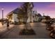 Walkway with shops and landscaping at sunset at 7420 Newham Ln, Sarasota, FL 34240