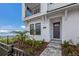 Townhouse exterior, showcasing the front entrance and landscaping at 7420 Newham Ln, Sarasota, FL 34240