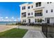 Modern, three-story waterfront townhome with private fenced yard at 7420 Newham Ln, Sarasota, FL 34240