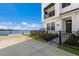 Front entrance of a modern townhouse with waterfront view at 7420 Newham Ln, Sarasota, FL 34240