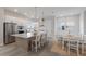 Modern kitchen with large island, stainless steel appliances, and white cabinetry at 7420 Newham Ln, Sarasota, FL 34240