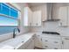 Modern white kitchen with lake view at 7420 Newham Ln, Sarasota, FL 34240