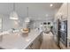 Modern kitchen with large island and stainless steel appliances at 7420 Newham Ln, Sarasota, FL 34240