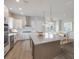 Modern kitchen with large island and stainless steel appliances at 7420 Newham Ln, Sarasota, FL 34240