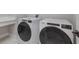 Bright laundry room with Whirlpool washer and dryer at 7420 Newham Ln, Sarasota, FL 34240