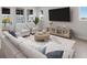 Spacious living room with sectional sofa and large TV at 7420 Newham Ln, Sarasota, FL 34240