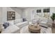 Bright and airy living room with comfortable seating and built-in shelving at 7420 Newham Ln, Sarasota, FL 34240
