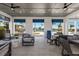 Relaxing poolside lounge area with seating and fans at 7420 Newham Ln, Sarasota, FL 34240