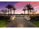 Brick walkway leading to a lakeside community area at 7420 Newham Ln, Sarasota, FL 34240