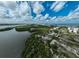 Aerial view of mangrove preserve with parking area and calm waters at 800 S Blvd Of Presidents # 12, Sarasota, FL 34236